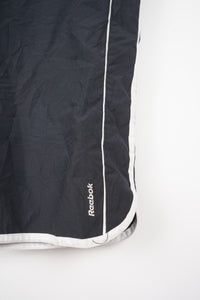 VINTAGE REEBOK 3/4 TRACK PANT SHORTS (XL)