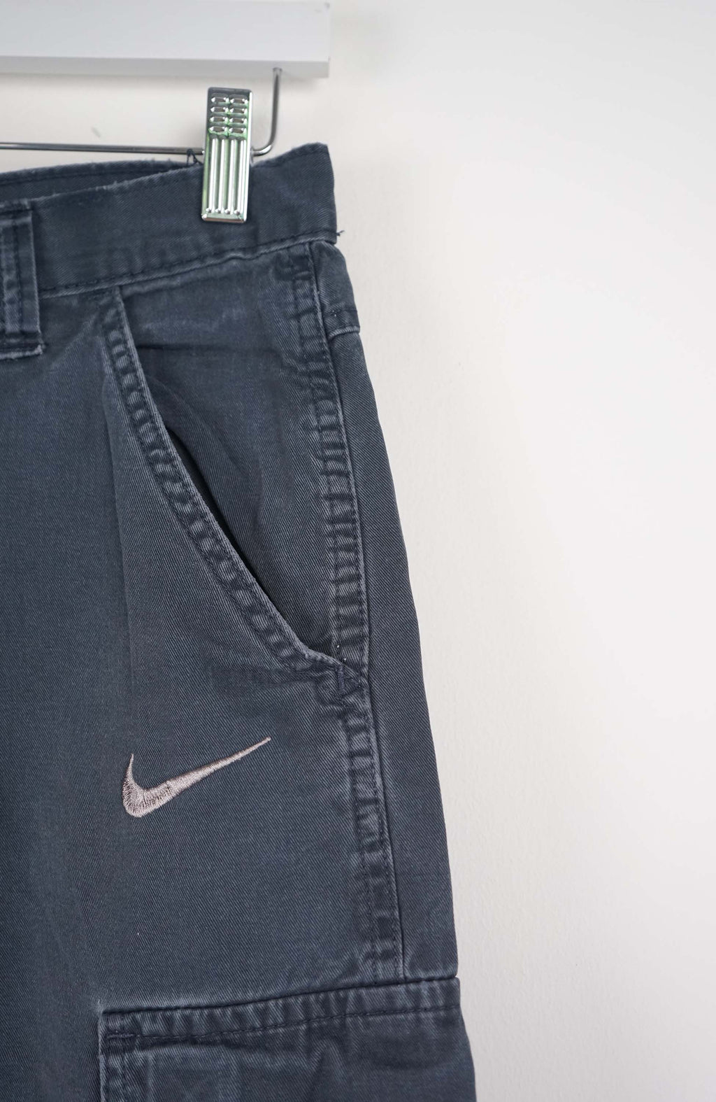 Blue shorts with a Nike logo on a white background