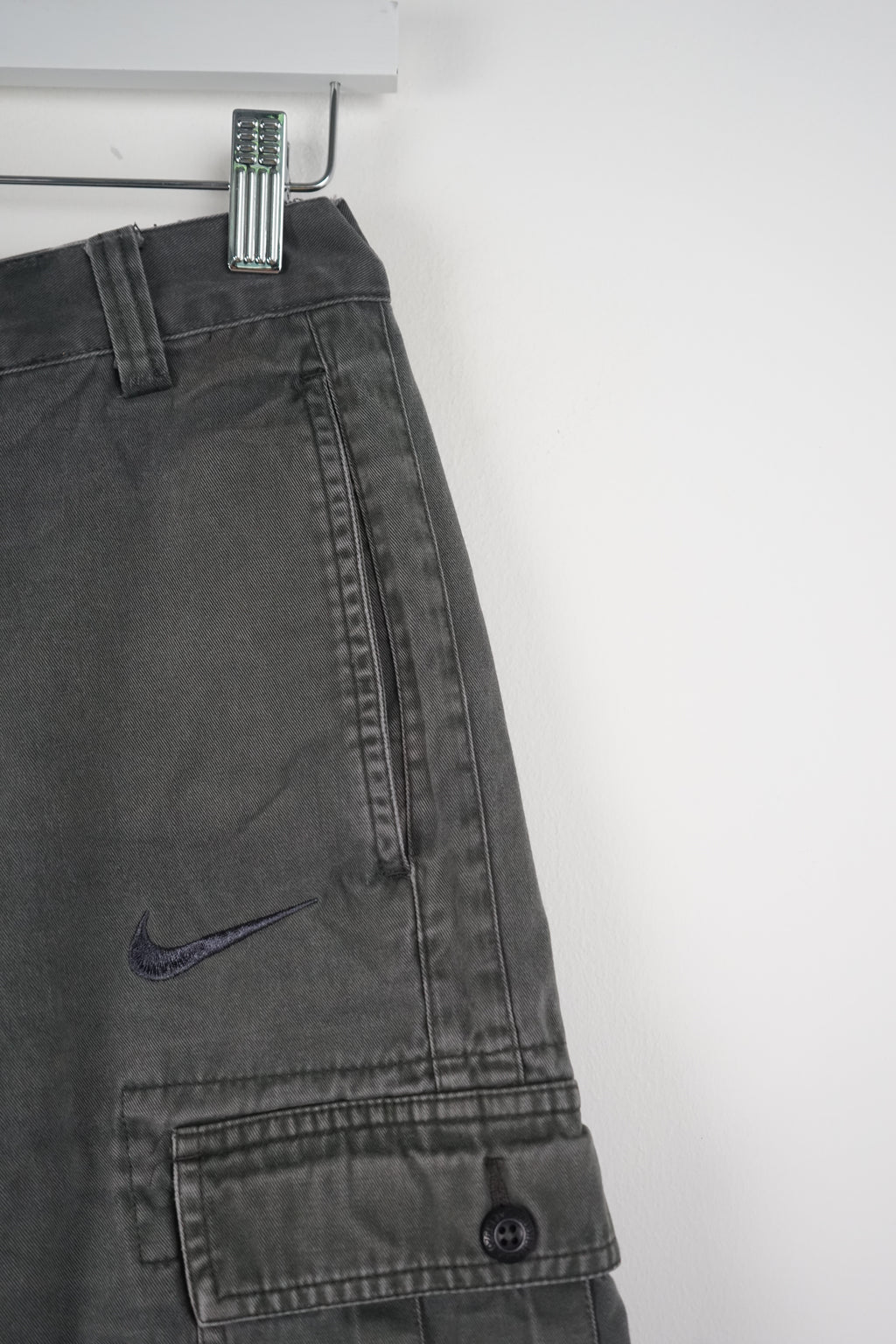 Gray cargo shorts on a white background