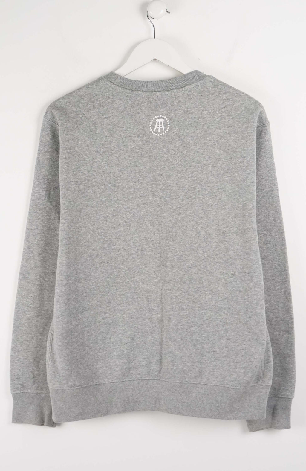 Gray sweatshirt with 'Barstool Sports' text and Nike logo on a white background