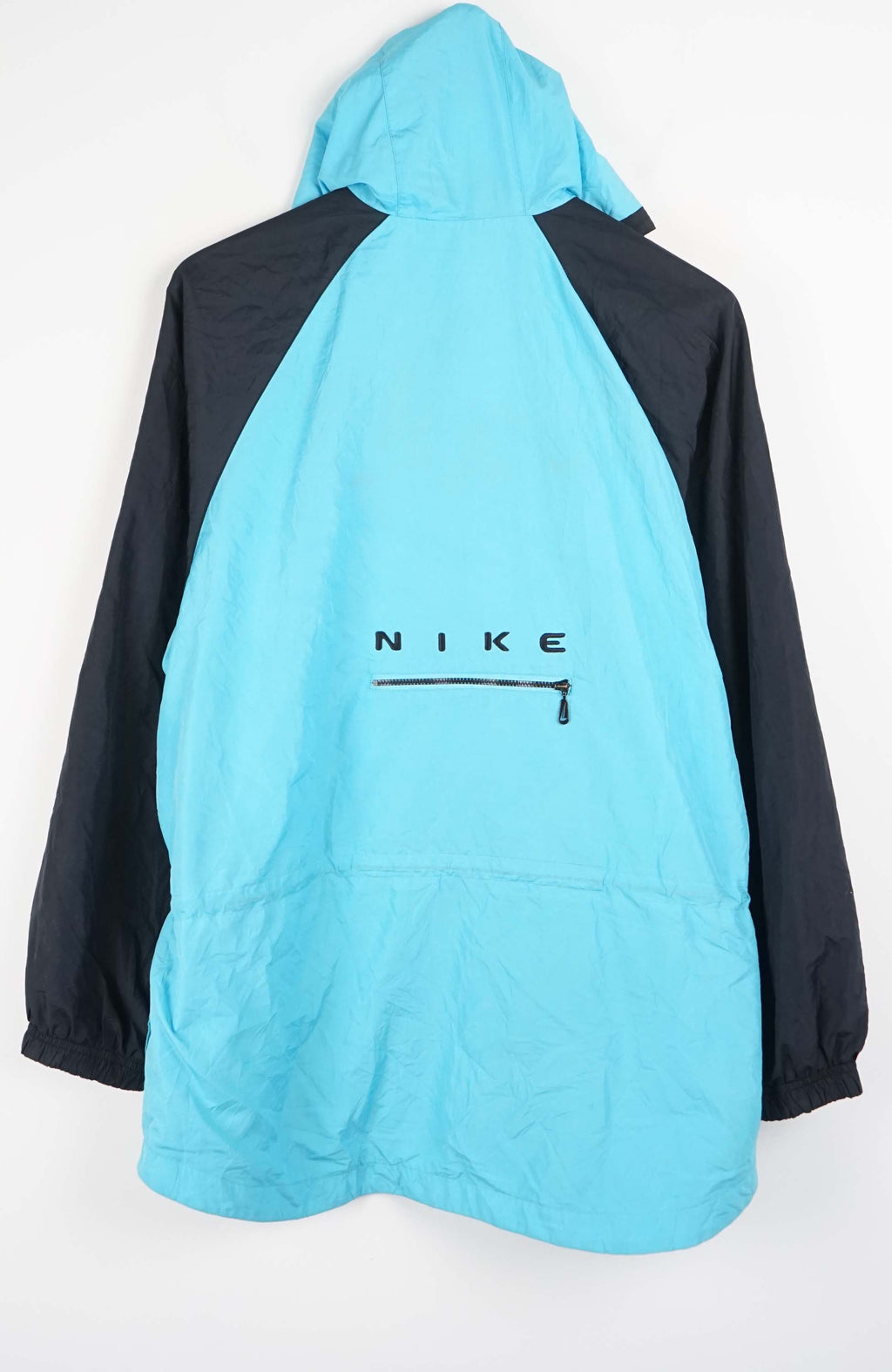 Light blue and black jacket with a hood on a white background