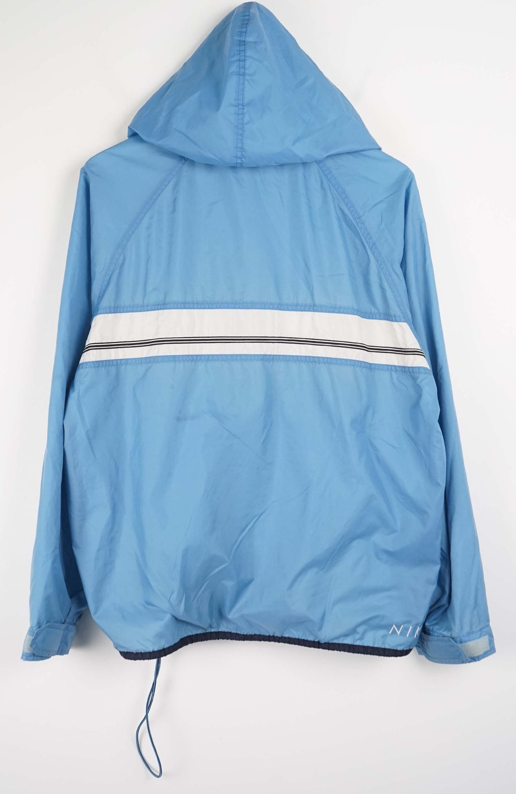 Blue hooded jacket with a Nike logo on a white background