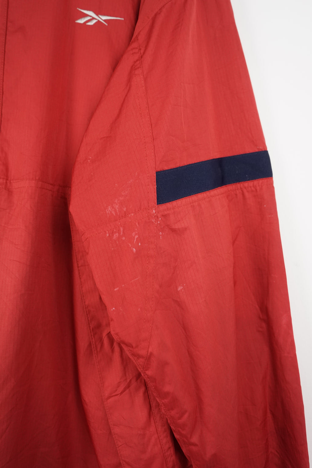 Red hooded jacket with a brand logo on a white background