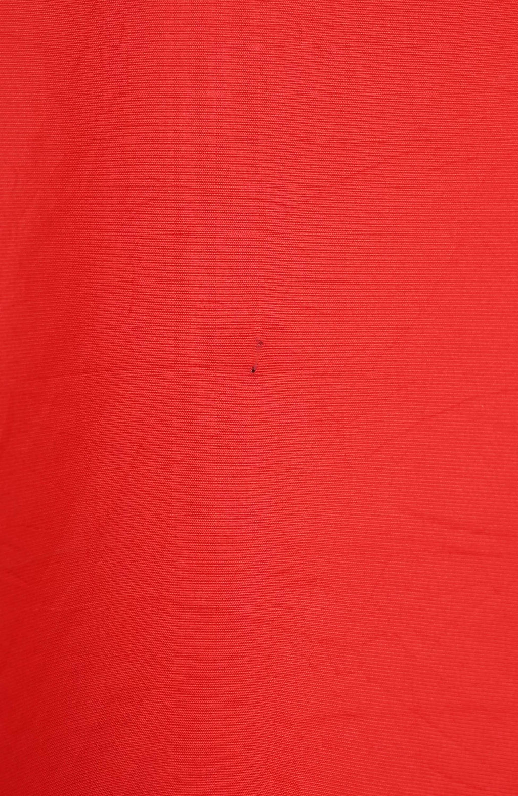 Red long-sleeve shirt with a logo on a white background