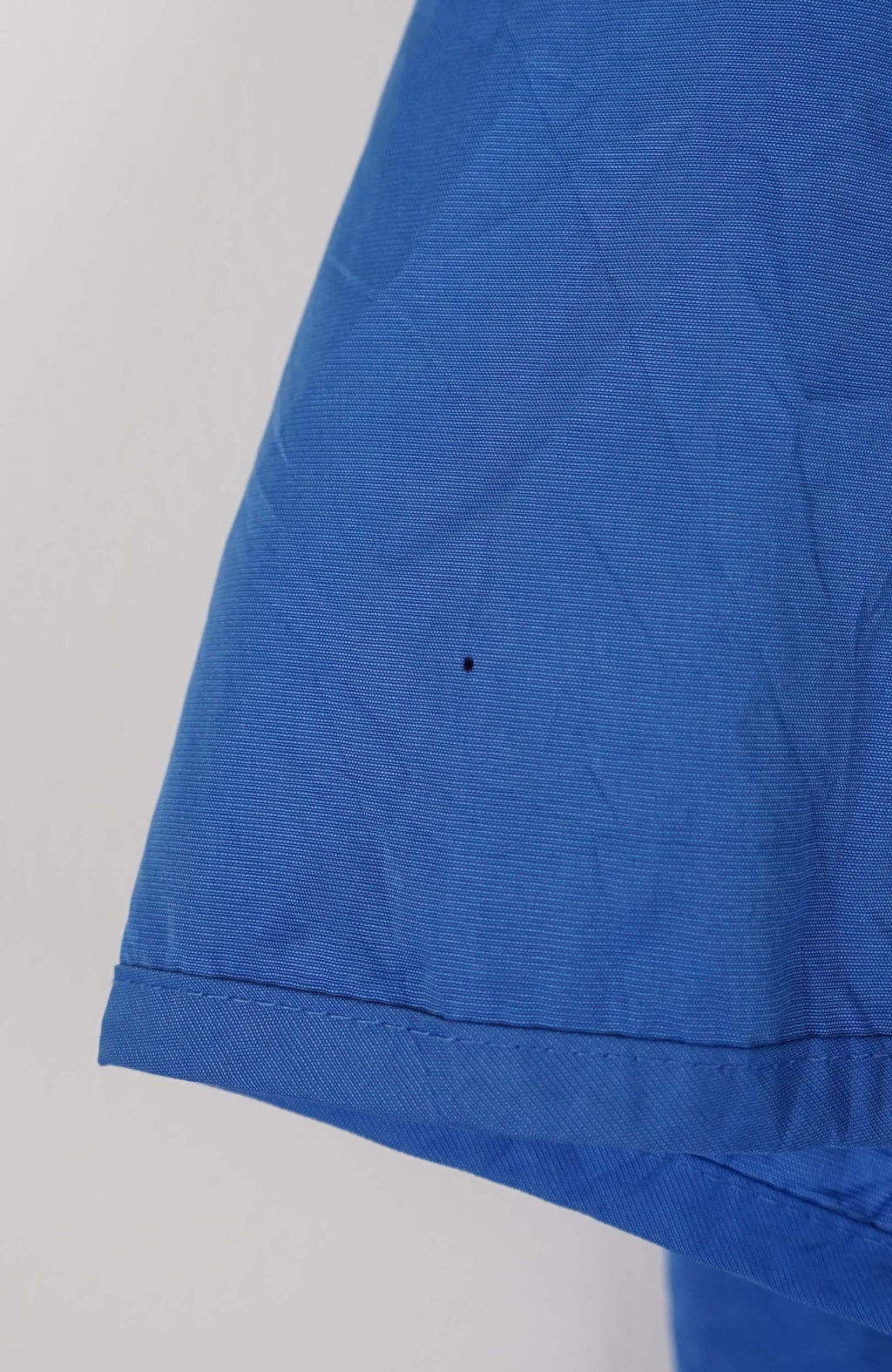 Blue jacket with Nike logo on a white background