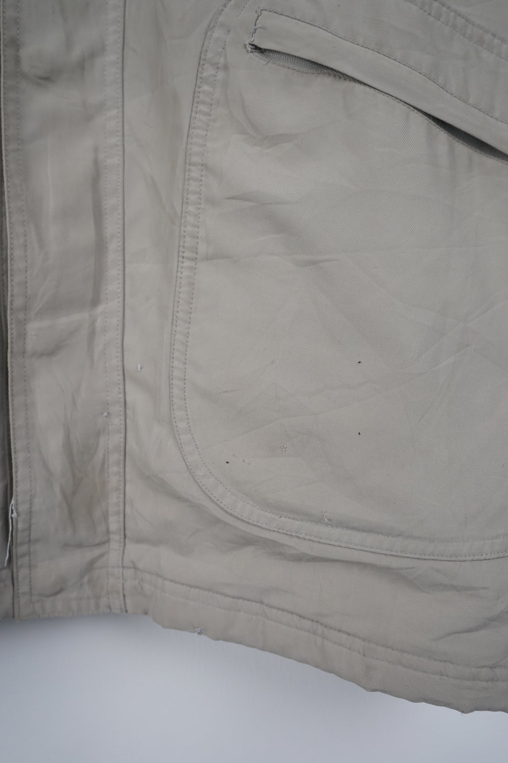 Beige jacket with Adidas logo on a white background