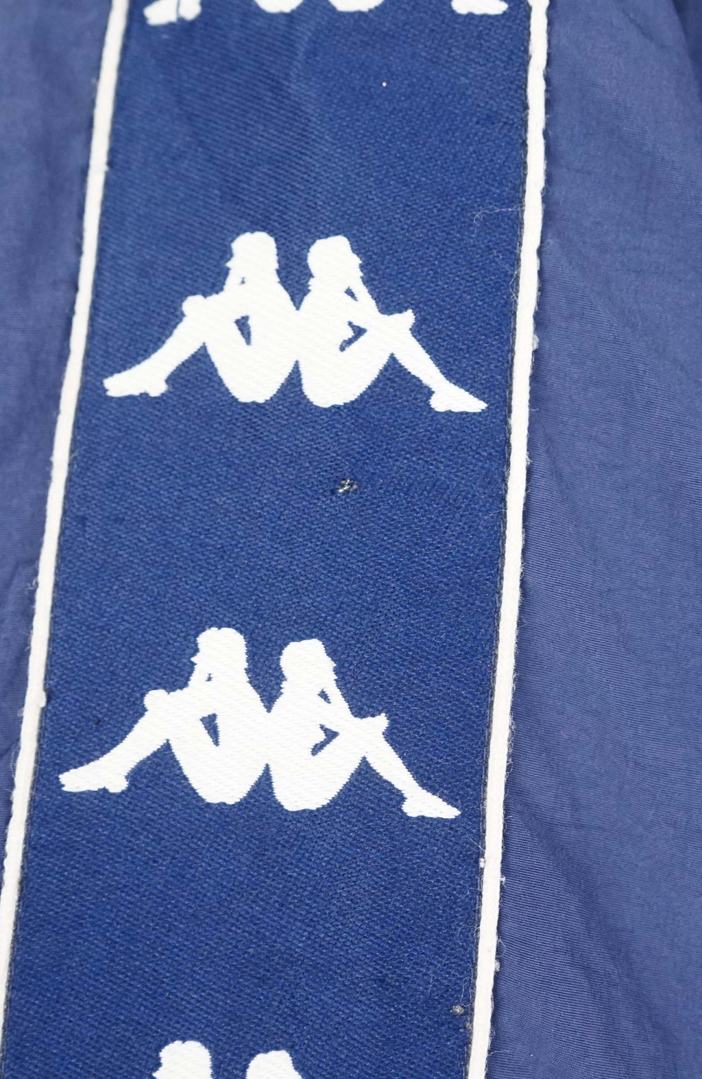 Blue jacket with white logo patterns on a white background