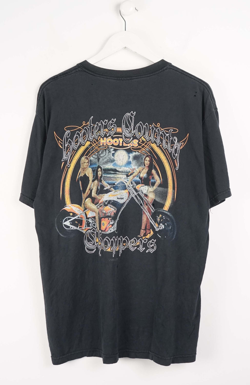 Black t-shirt with text on a white background