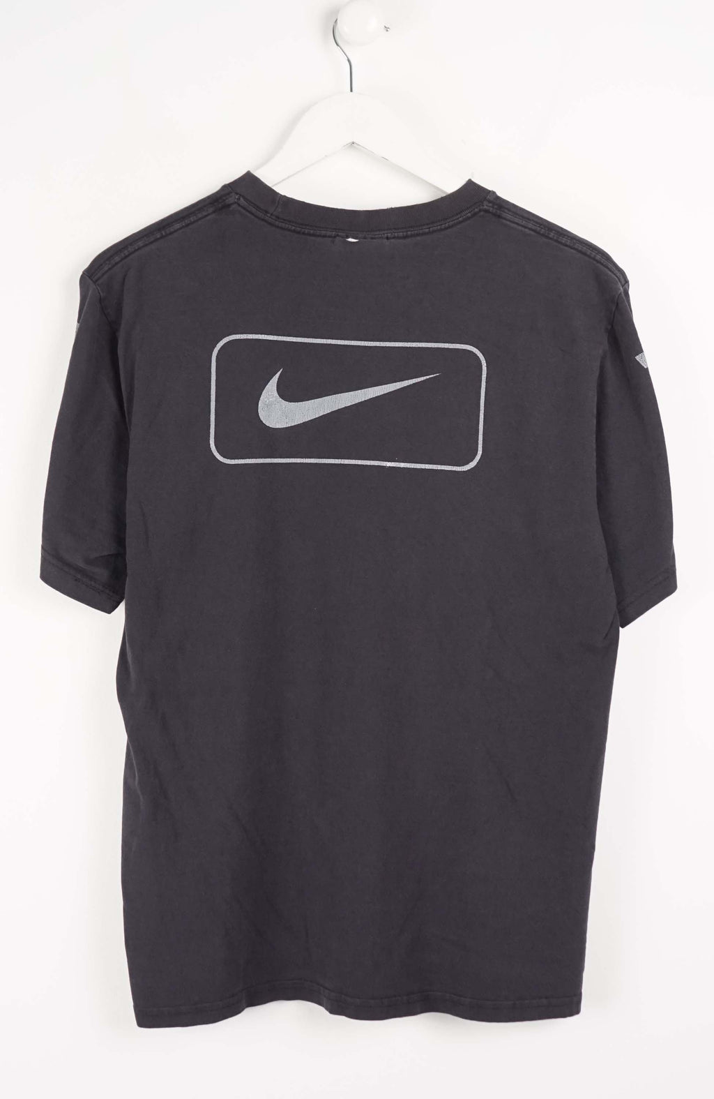 Black t-shirt with Nike logo and striped sleeves on a white background