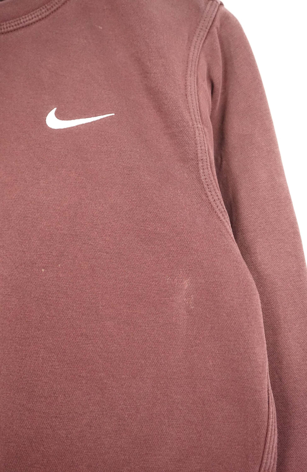 Brown sweatshirt with Nike logo on a white hanger