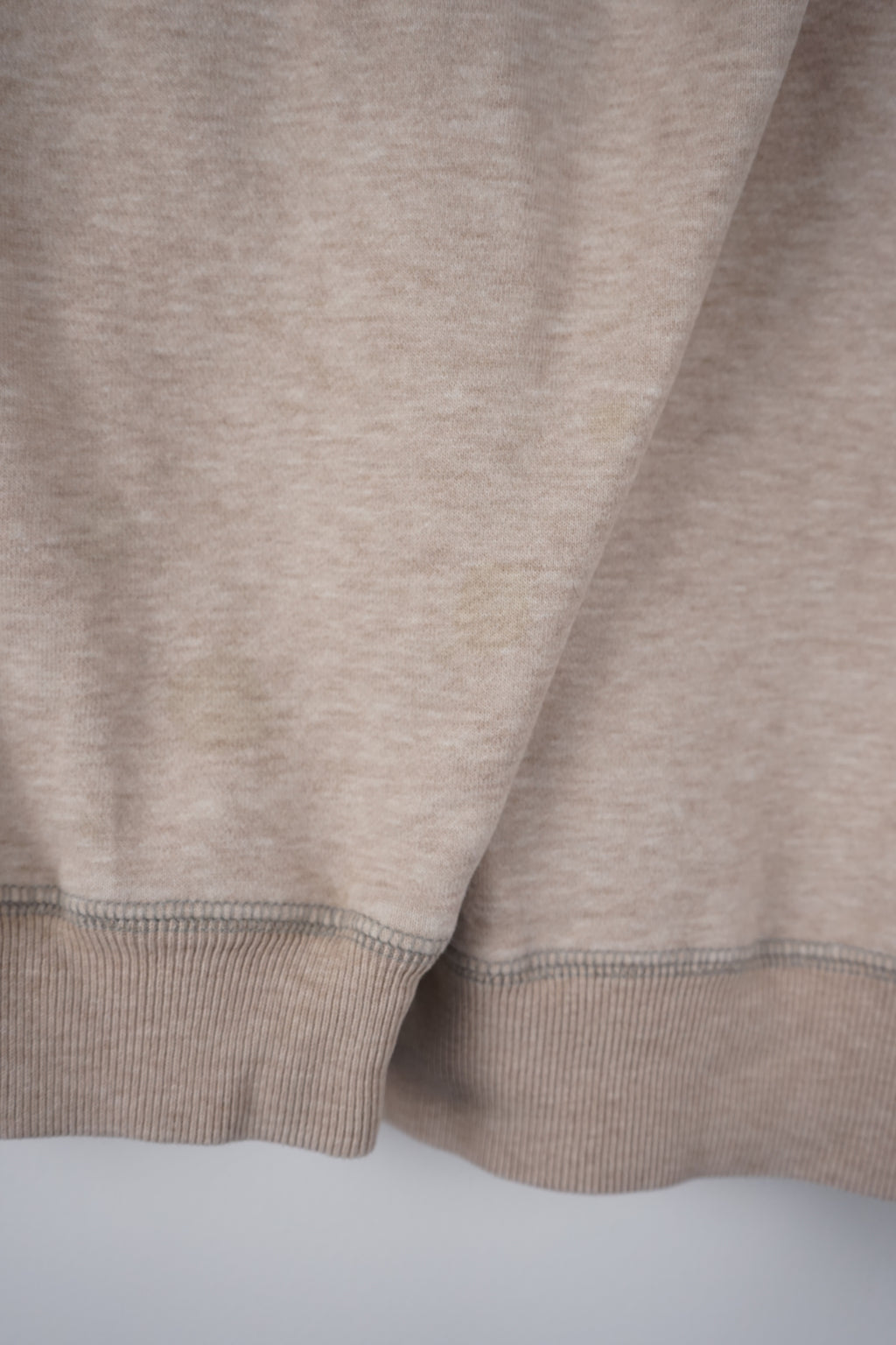 Beige sweatshirt with Nautica logo on a white background
