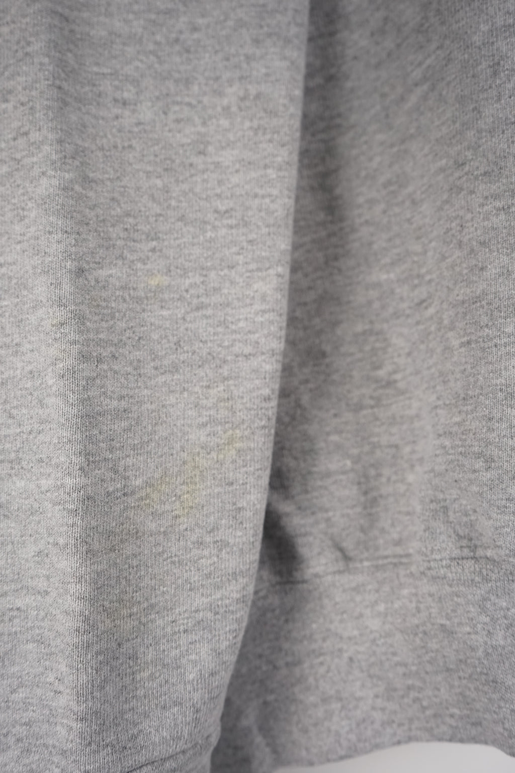 Gray sweatshirt with a small logo on a white background