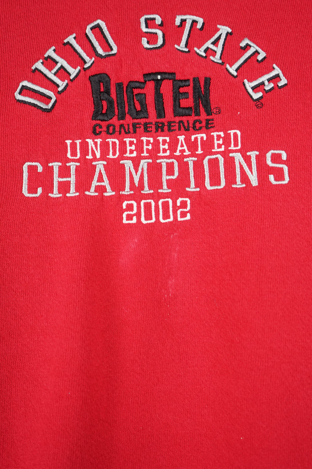 Red sweatshirt with text on a white background