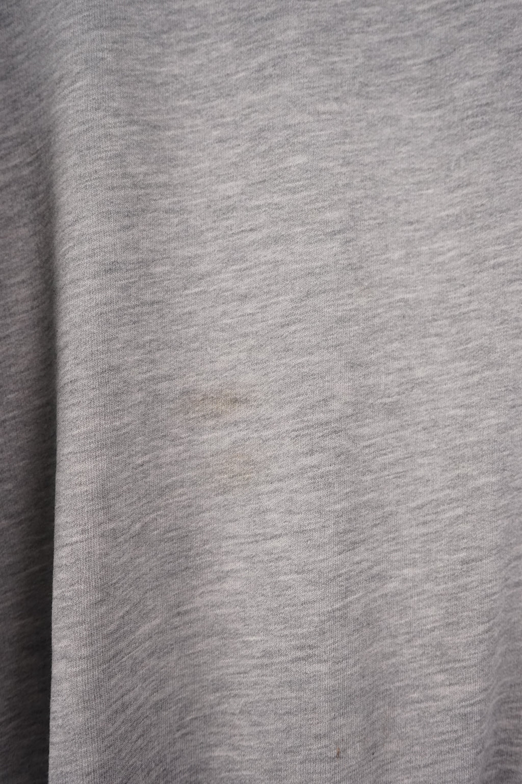 Gray sweatshirt with Nike logo and branding on a white background