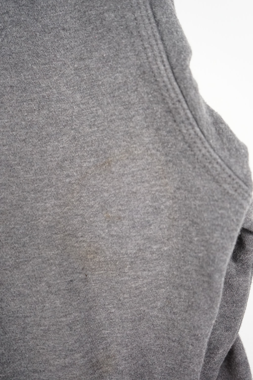 Gray hoodie with a Nike logo on a white background