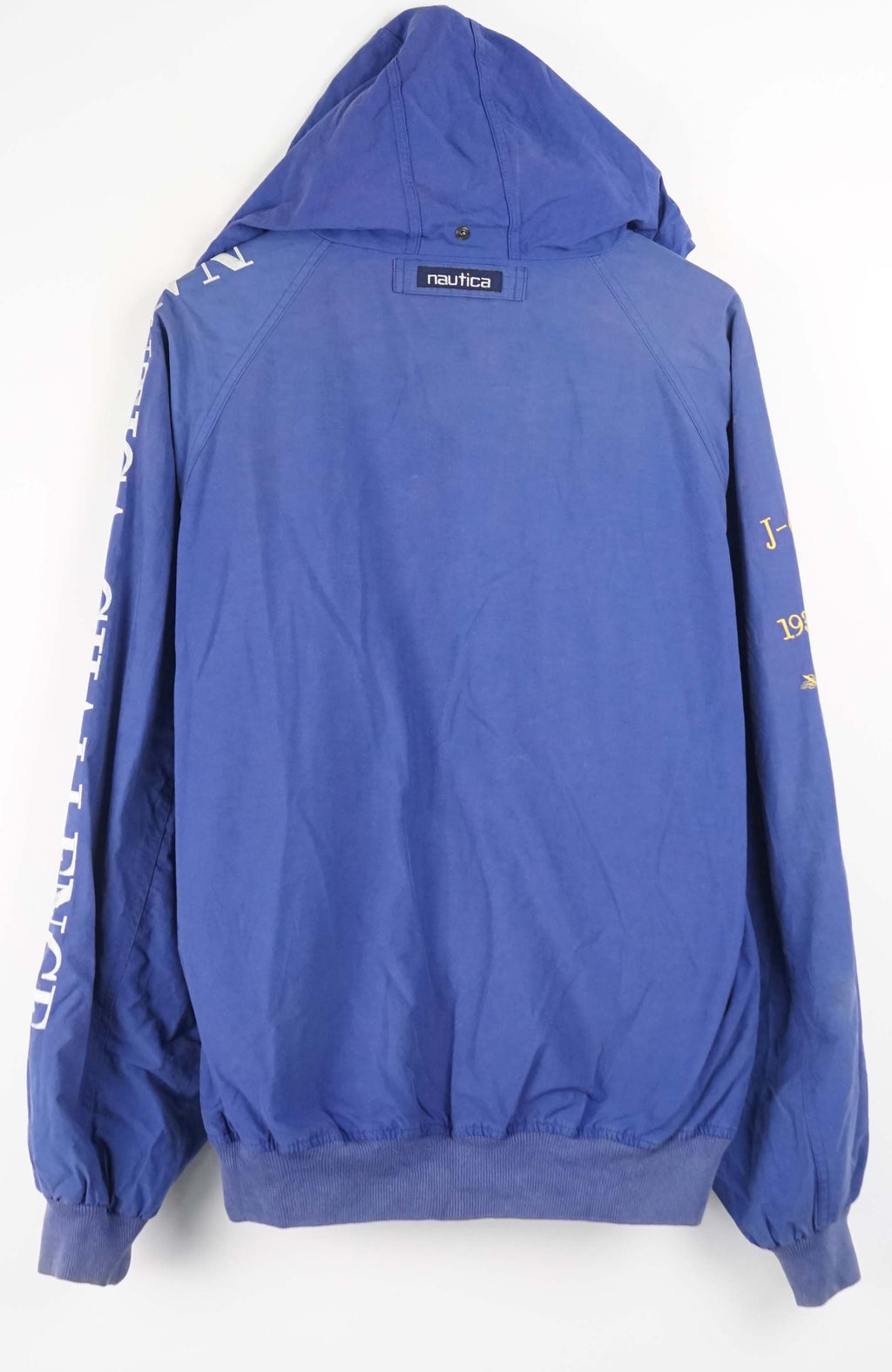 Blue jacket with yellow and white text and graphics on a white background
