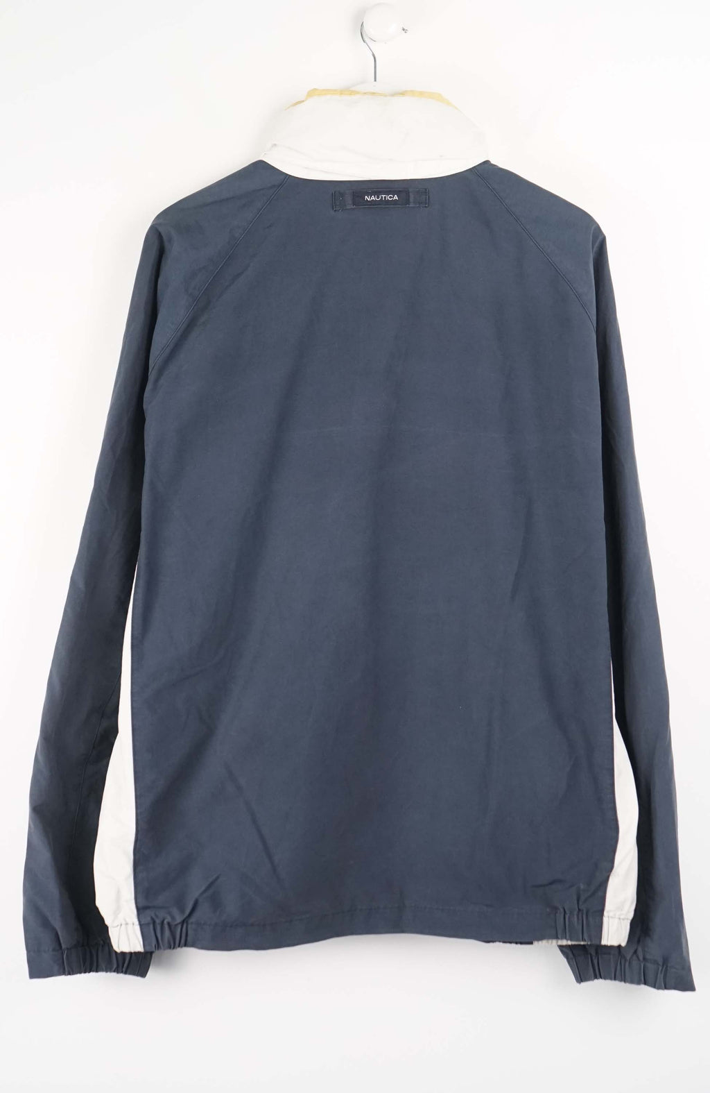 Nautica jacket on a hanger against a white background