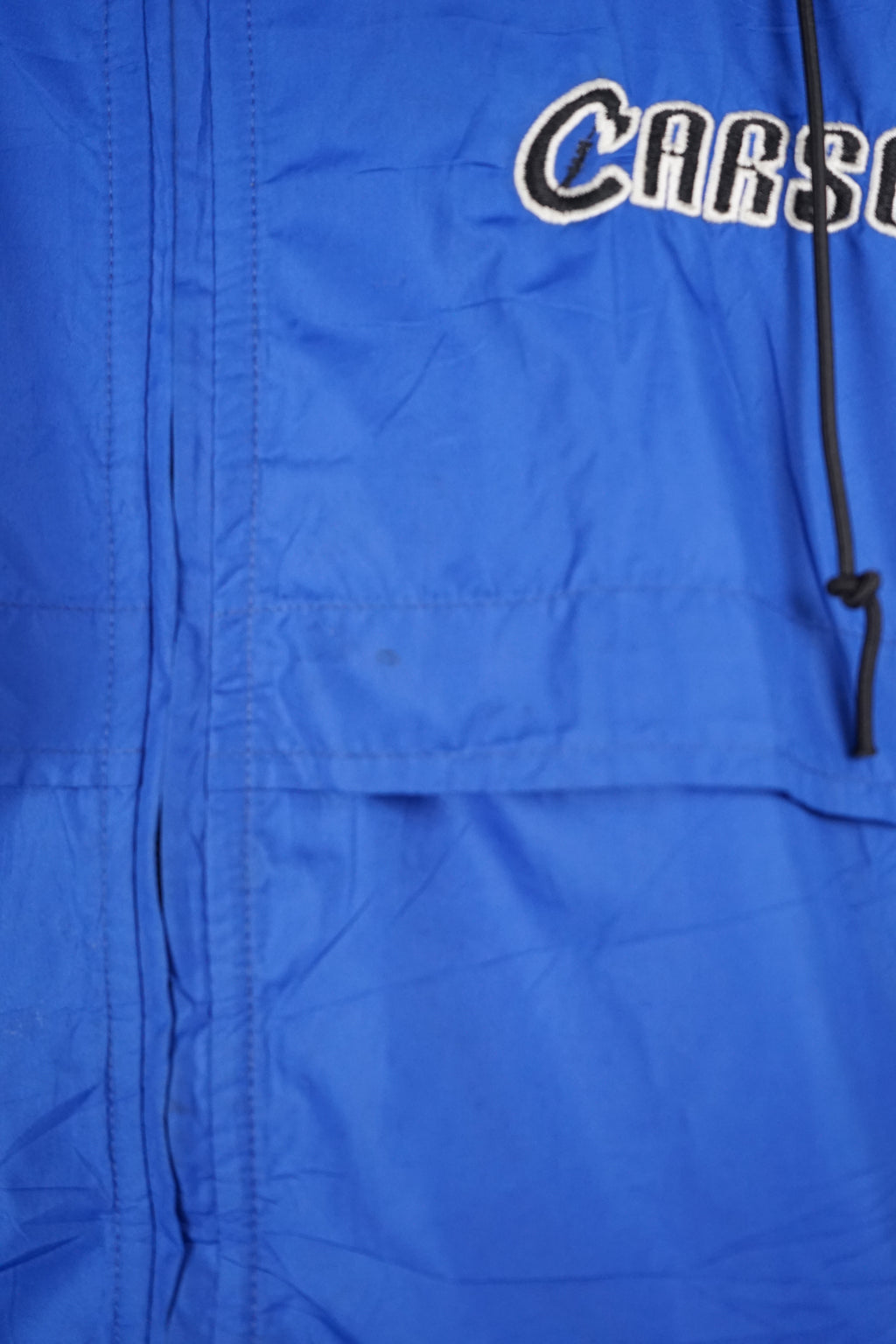 Blue jacket with a brand logo on a white background