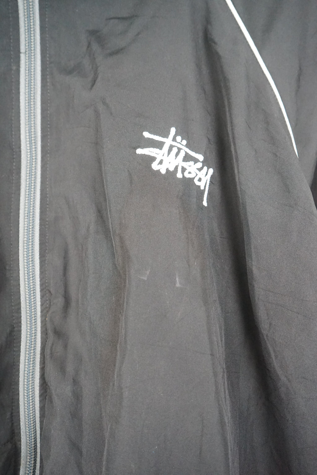 Black jacket with a logo on a white background