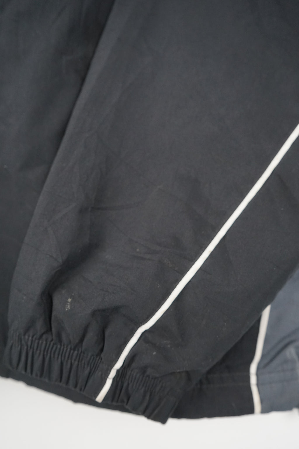 Black jacket with a logo on a white background