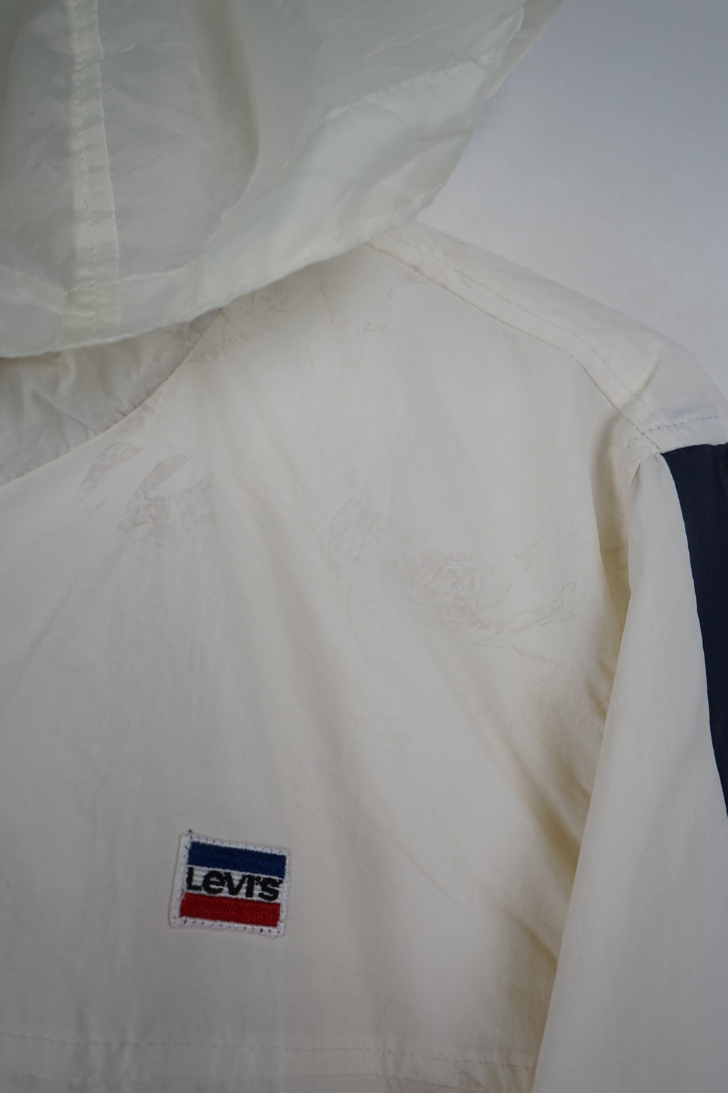 White jacket with Levi's branding on a white background