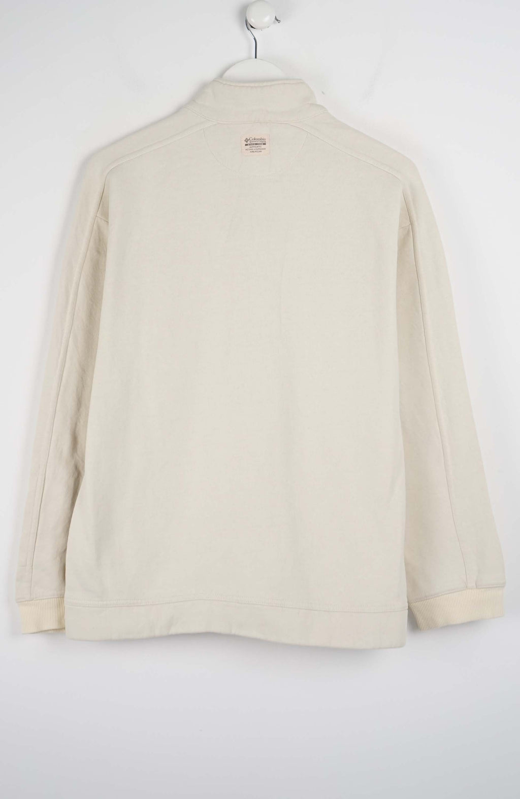 Beige fleece pullover with a quarter zip on a white background