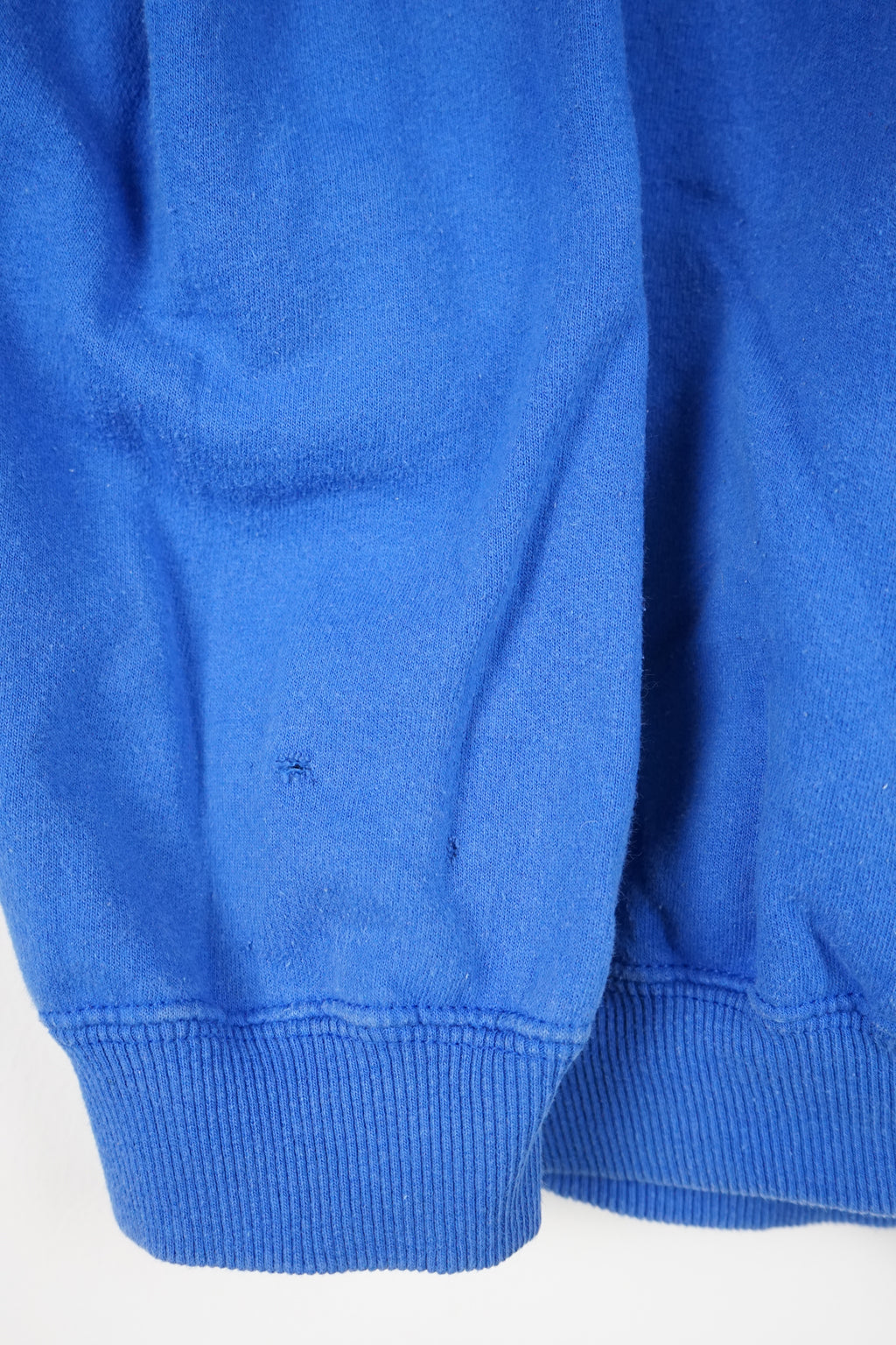Blue sweatshirt with text on a white background