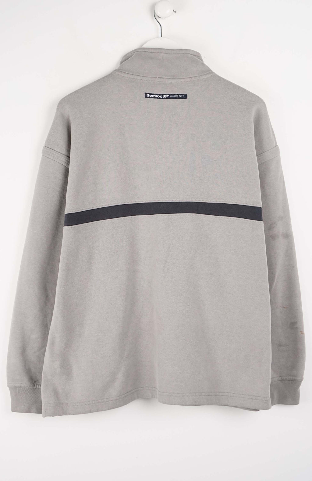Gray pullover with a black stripe and Reebok logo on a white background