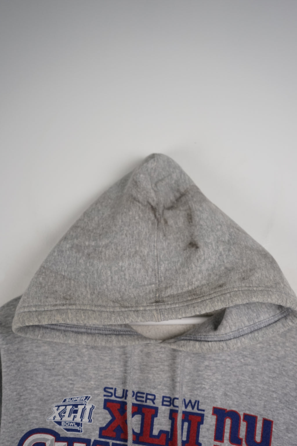 Gray hoodie with Super Bowl Champions text on a white background