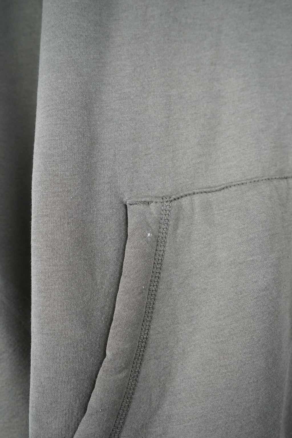 Green hoodie with 'GAP' logo on a white background
