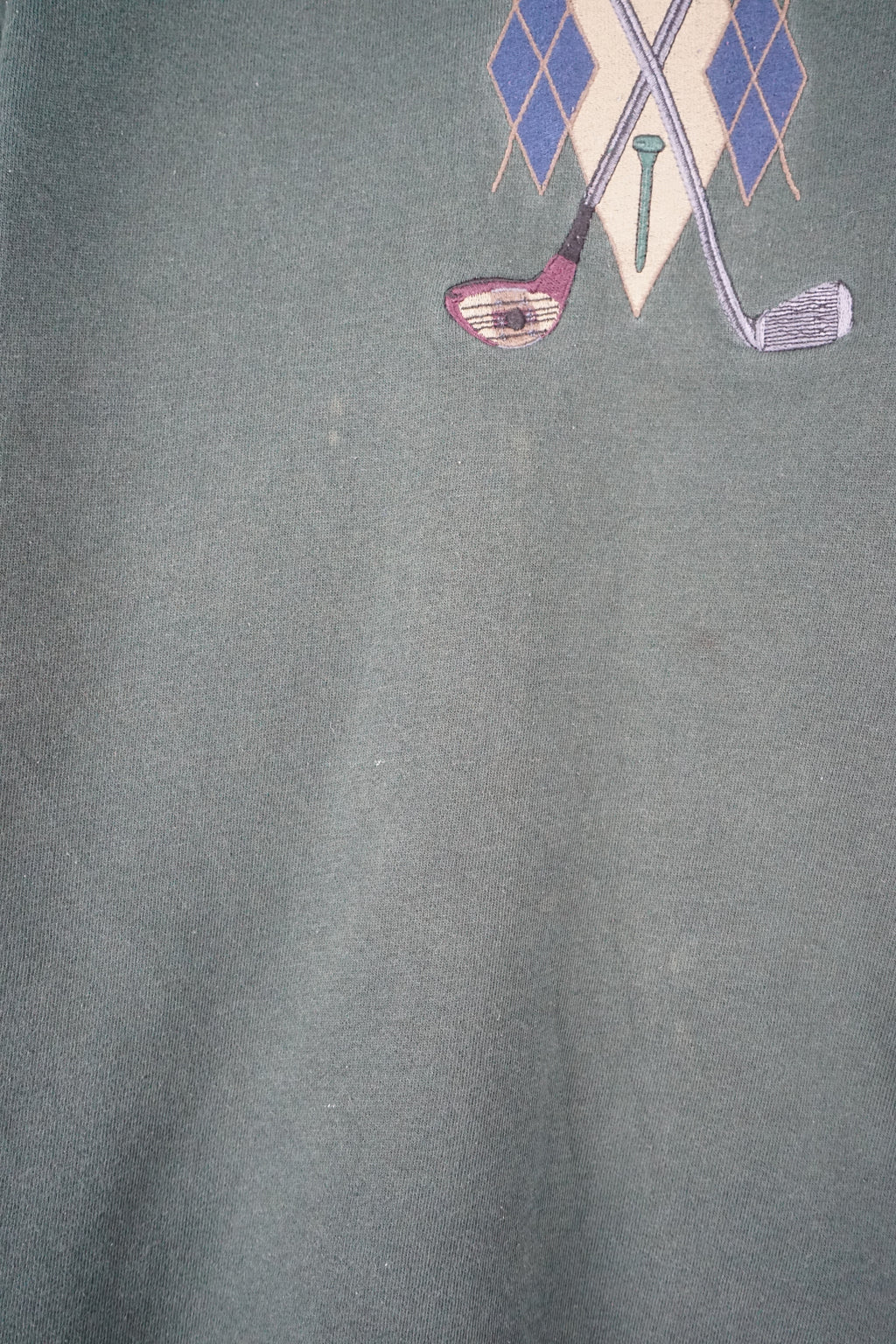 Dark green sweatshirt with a graphic design on a white background