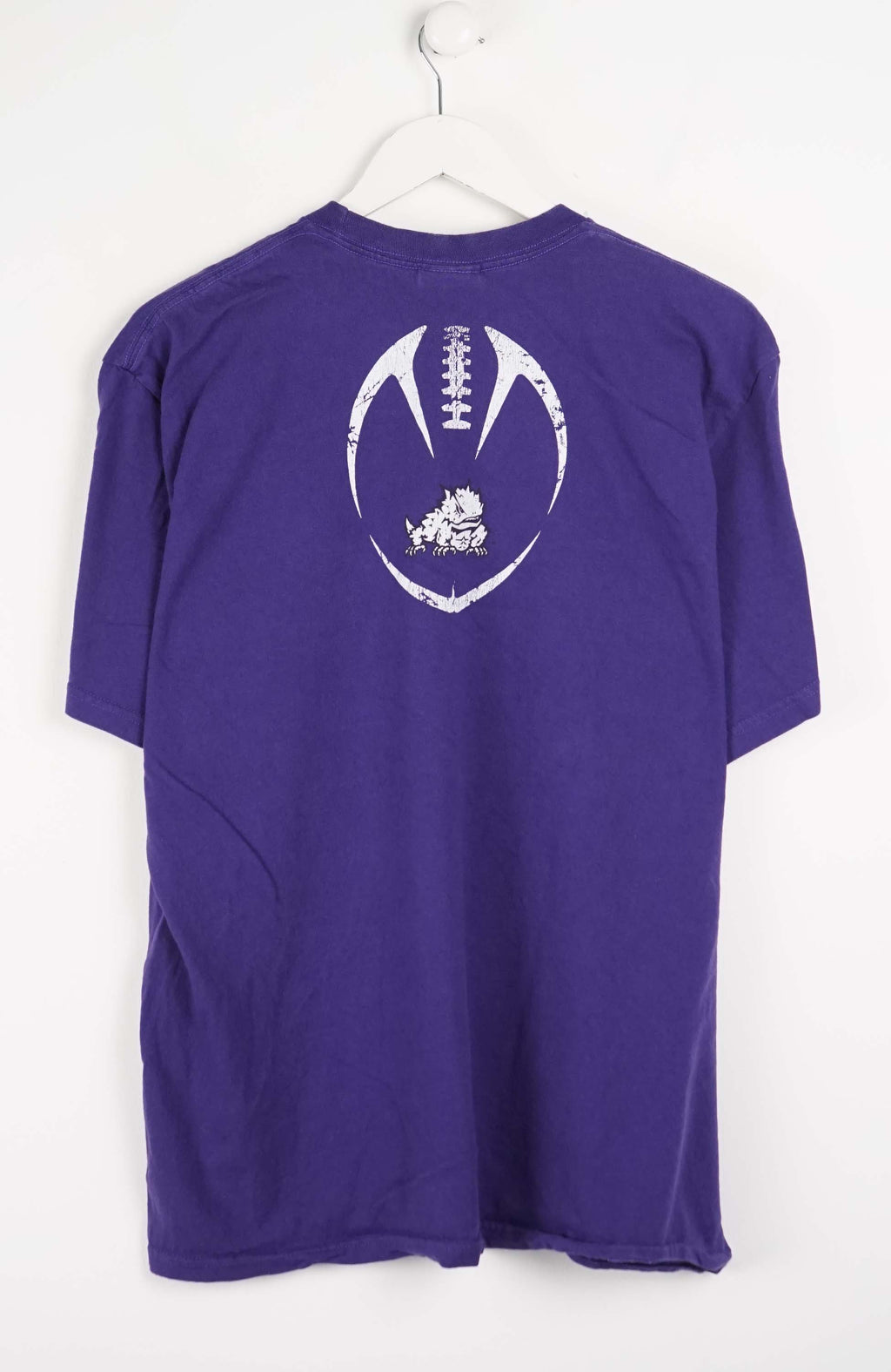 Purple t-shirt with 'FOOTBALL TCU' text and Nike logo on a white background