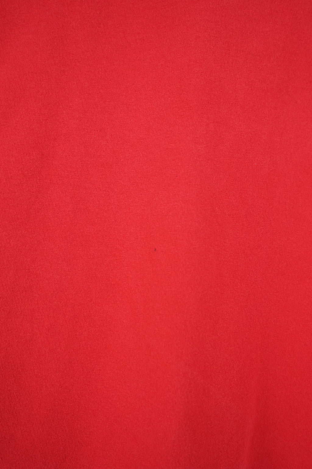 Red t-shirt with 'Georgia Football' text and Nike logo on a white background