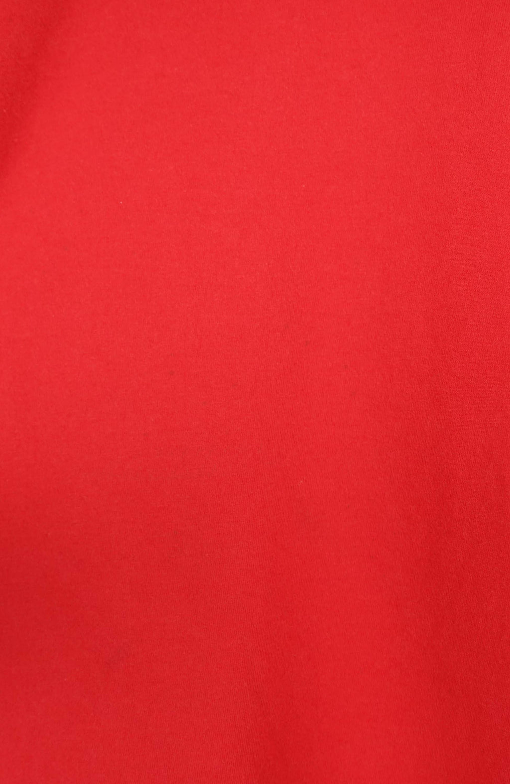 Red t-shirt with Nike logo on a white hanger against a white background