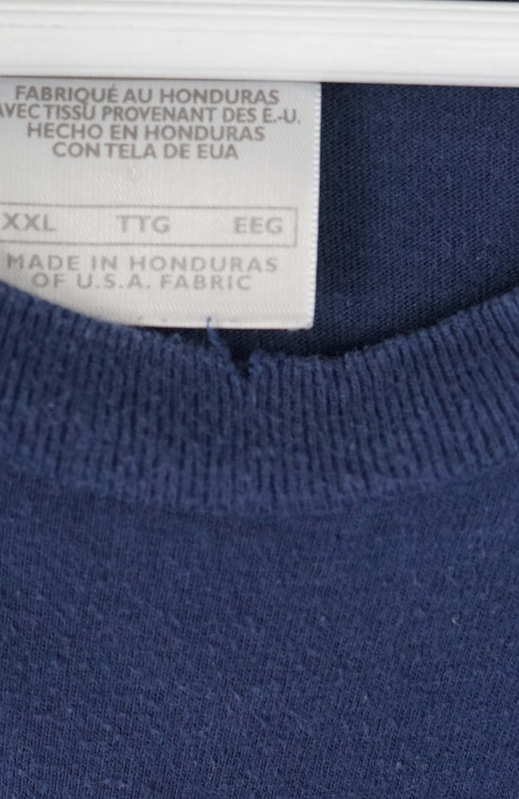 Navy blue t-shirt with Nike logo on a white background