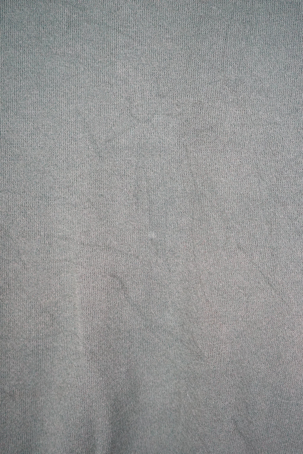Green sweatshirt with a logo on a white background