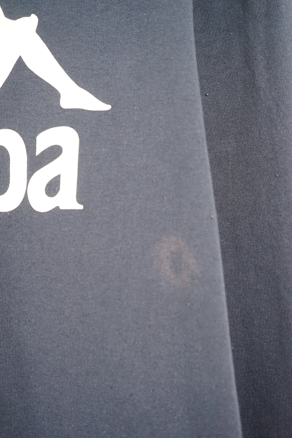 Navy blue Kappa sweatshirt on a white hanger