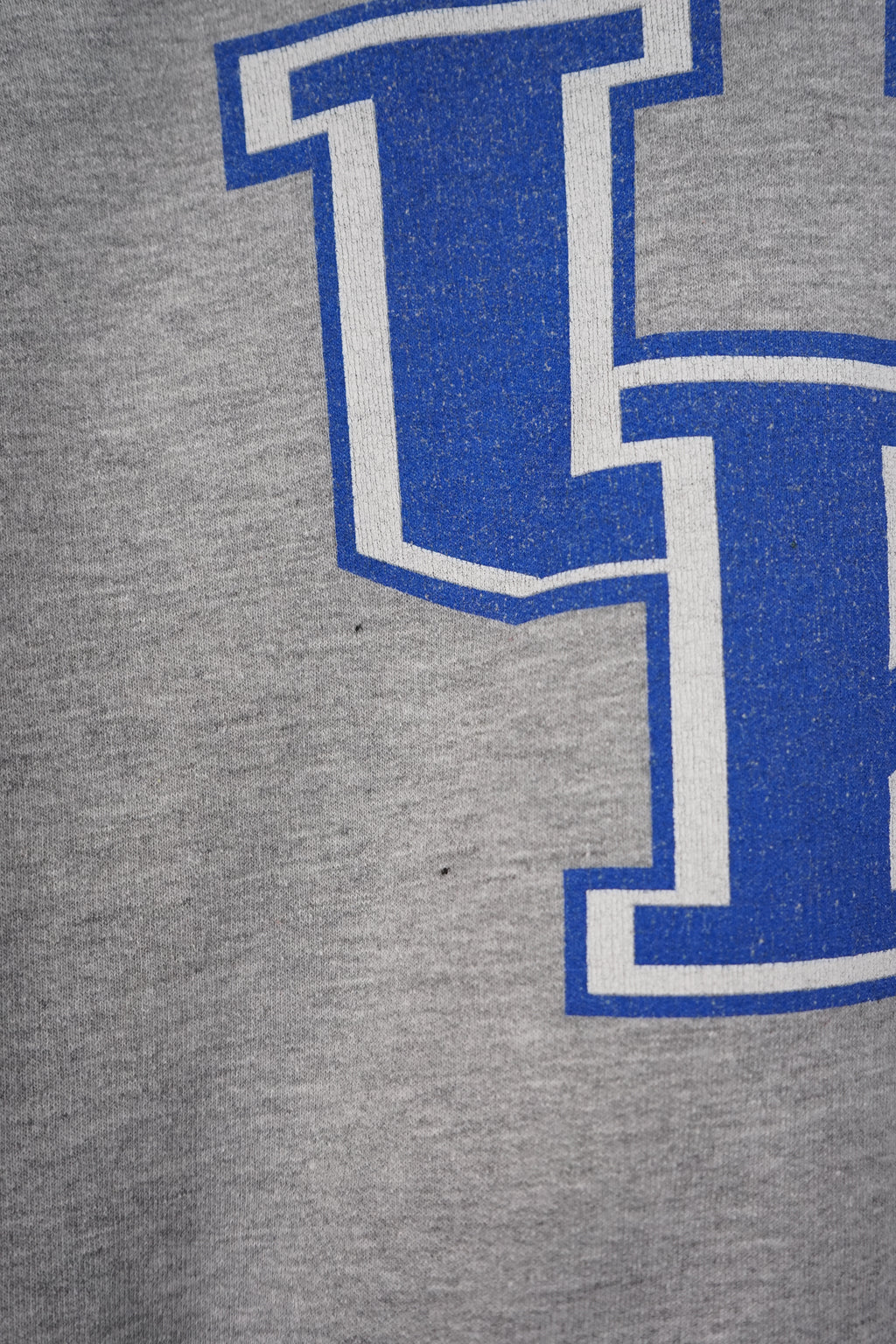 Gray sweatshirt with 'UK' logo on a white background