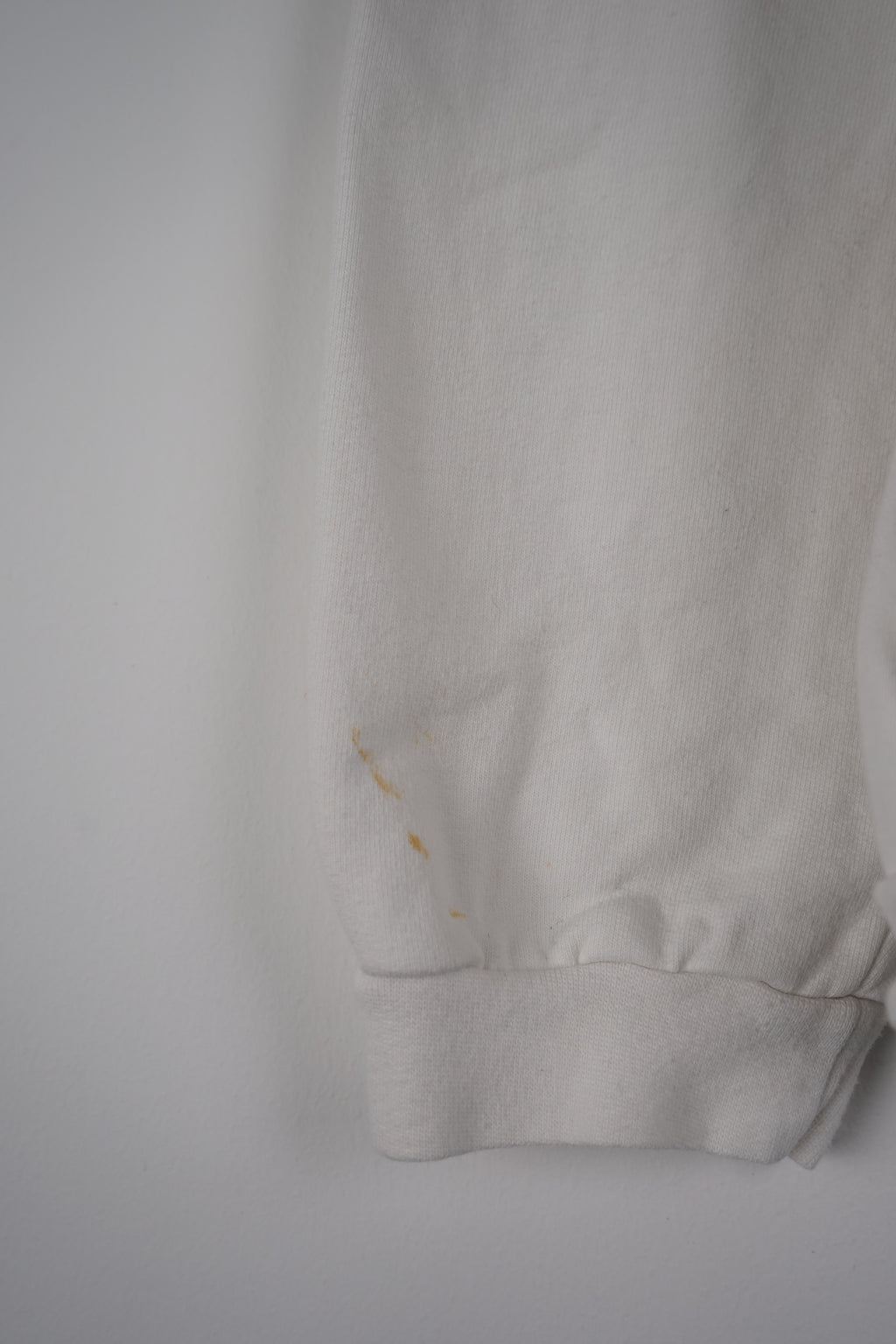 White long-sleeve shirt with Hard Rock Cafe logo on a white background