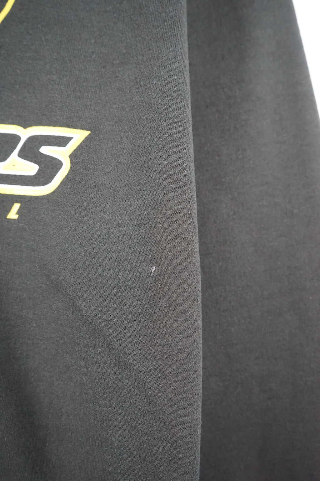 Black sweatshirt with Green Bay Packers logo on a white background