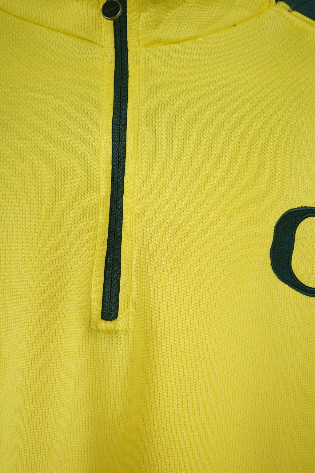 Yellow and green sports jersey with Nike logo on a white background