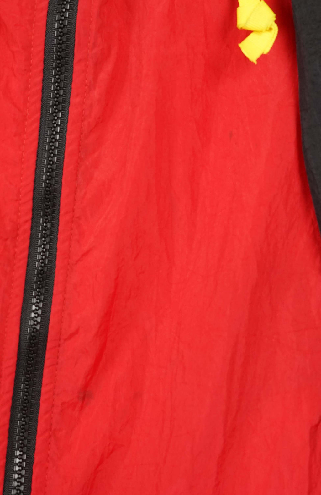 Red and black jacket with a hood on a white background