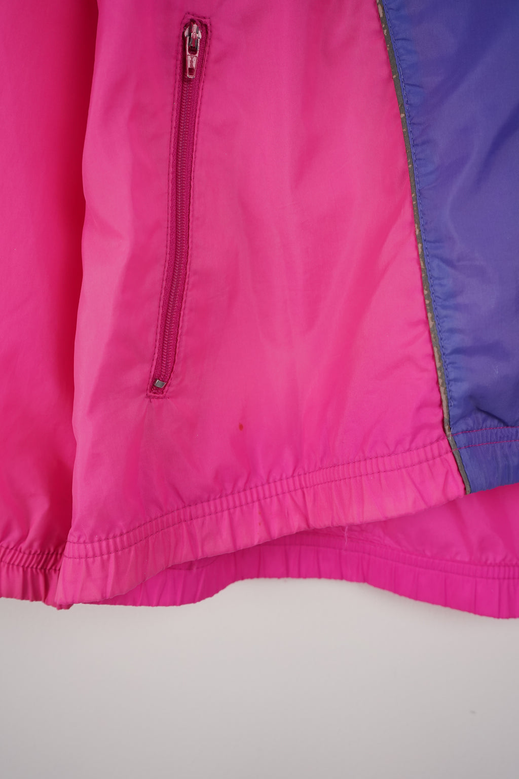 Colorful jacket with a brand logo on a white background