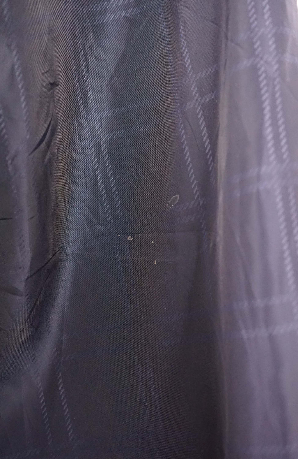 Navy blue long-sleeve shirt with a small logo on a white background