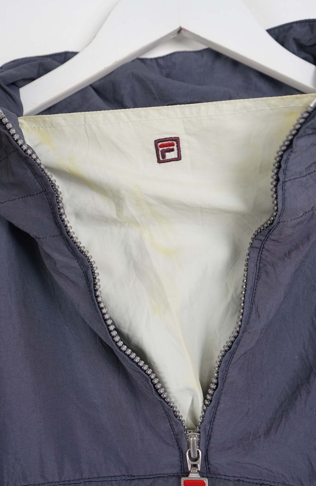 Gray pullover with a brand logo on a white background