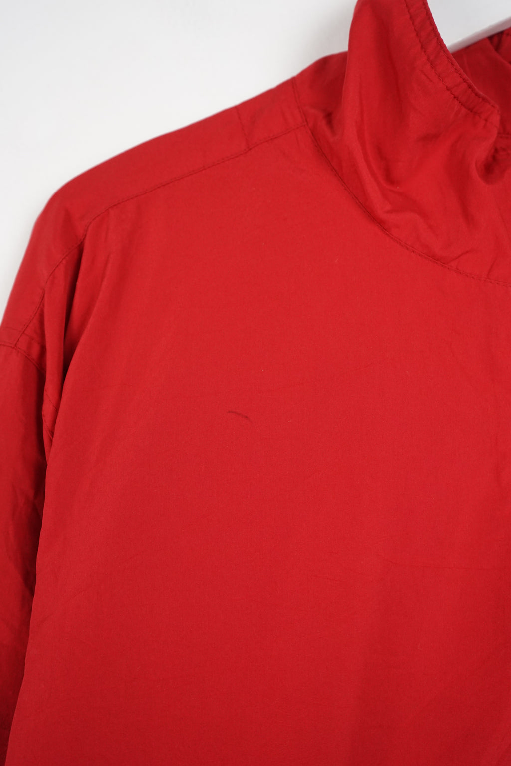 Red jacket with a logo on a white background