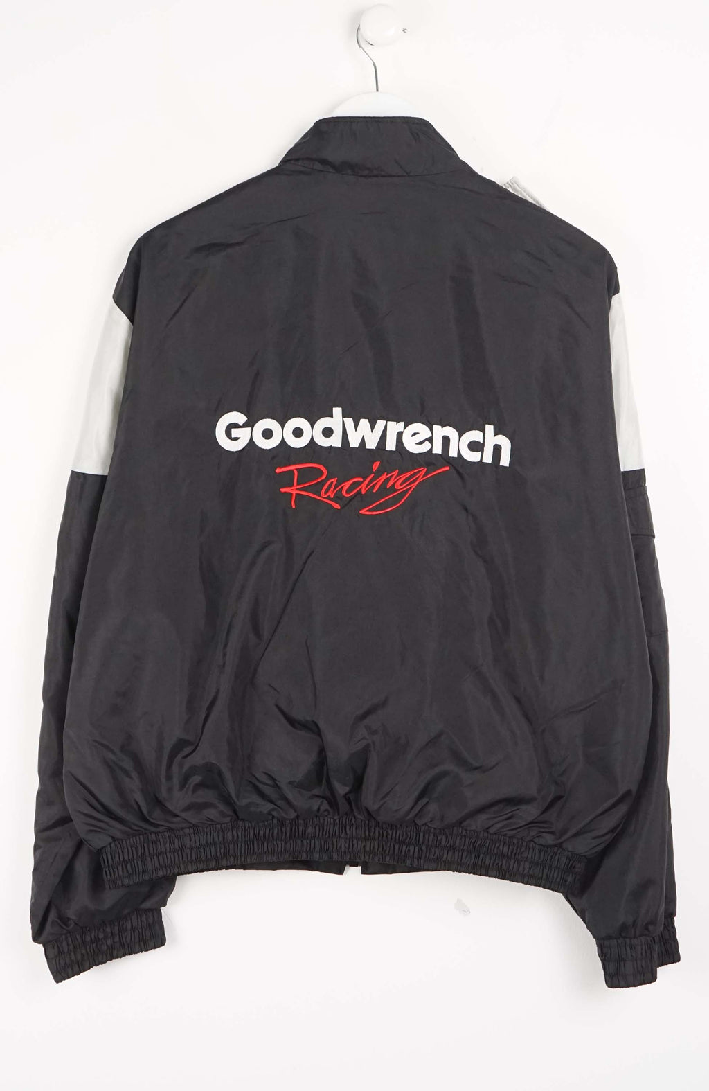 Two-tone jacket with black and gray design on a white background