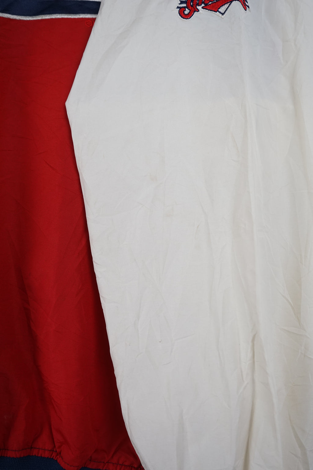 Red and blue sports jersey with 'Indians' branding on a white background