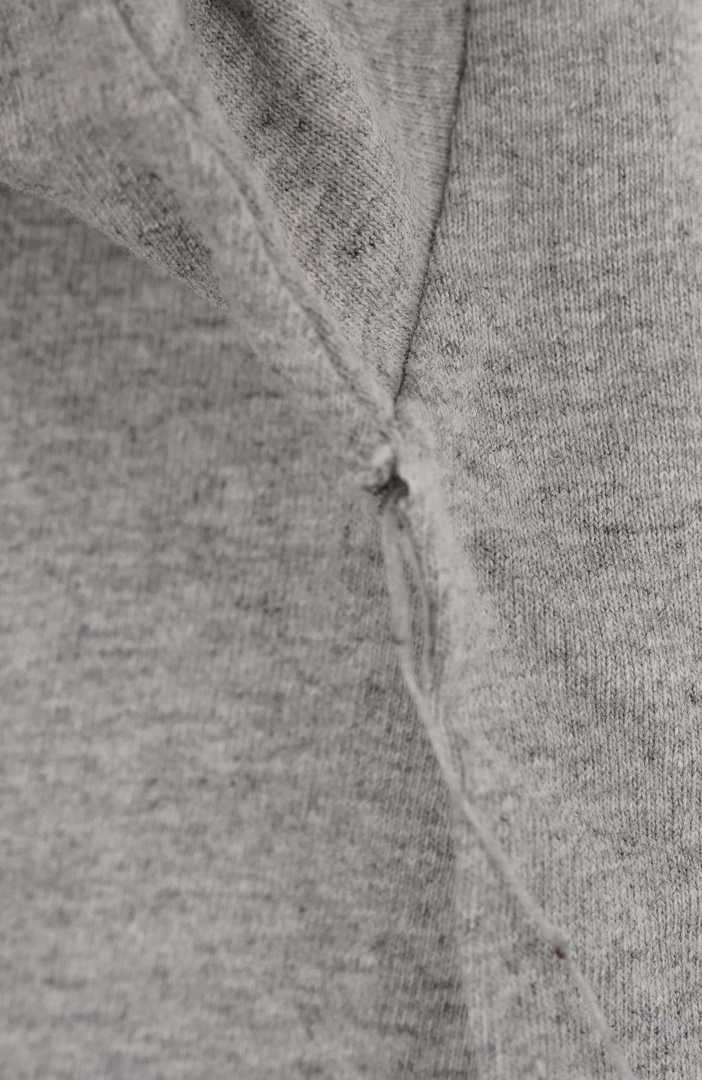 Gray long-sleeve shirt with 'Raiders' logo on a white background