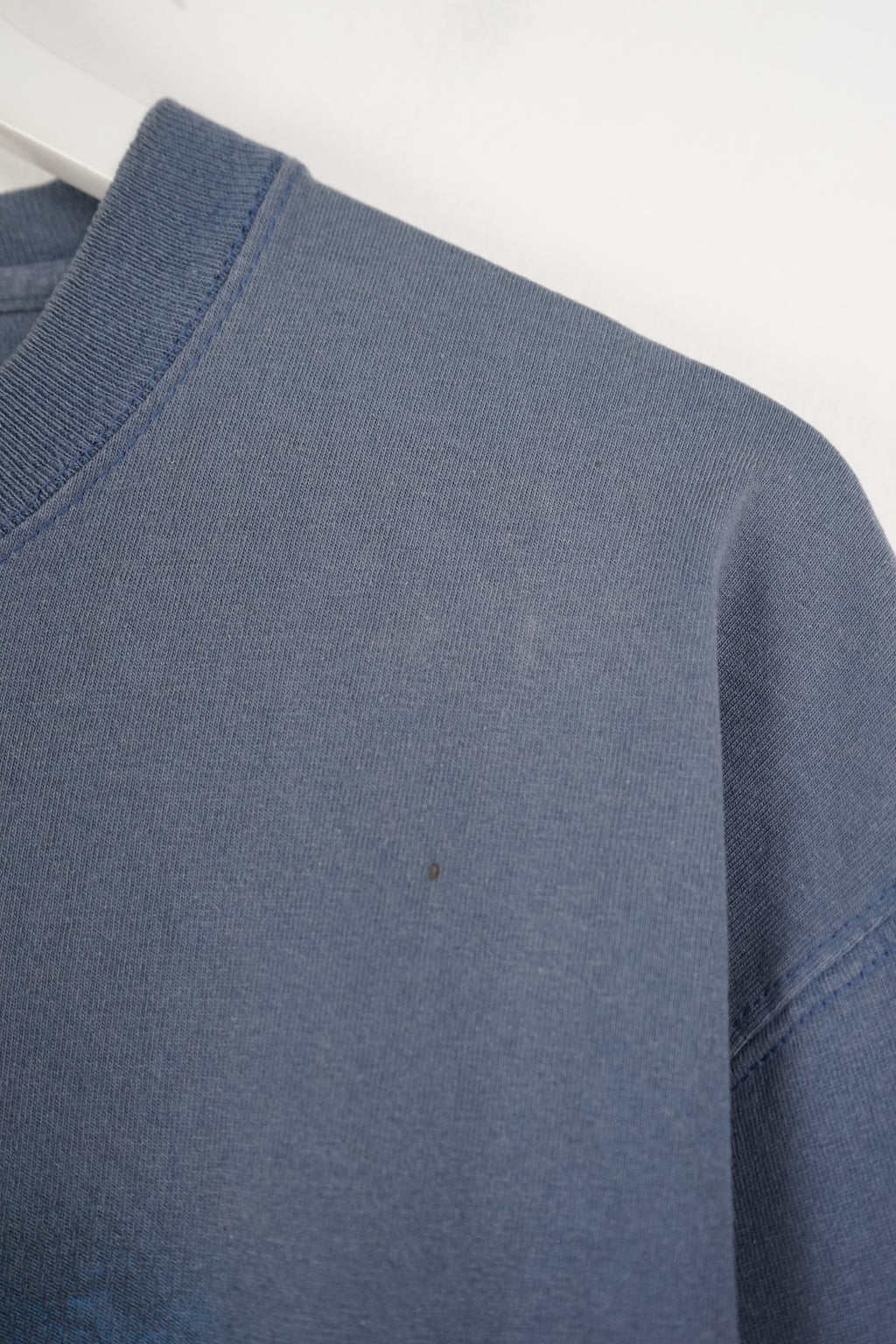 Blue t-shirt with Seattle Seahawks logo on a white background
